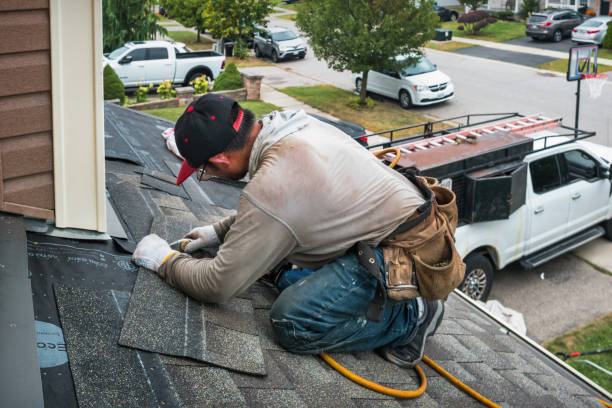Professional Roofing technician working in Medfield, MA